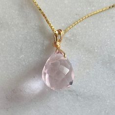 This is one of my classical pieces. I make this for my family and loved ones. And I wear one everyday. I designed this with a very delicate chain, so the rose Quartz looks as if it is just a sparkle floating on your skin. Rose Quartz is the stone of unconditional love, self love, universal love. Rose Quartz is the stone of universal love.  It restores trust and harmony in relationships, encouraging unconditional love. It purifies and opens the heart at all levels to promote love, self-love, frie Classic Pink Drop Jewelry, Minimalist Faceted Rose Gold Jewelry, Pink Birthstone Jewelry For Everyday, Dainty Pink Gold Jewelry With Birthstone, Everyday Pink Birthstone Jewelry, Dainty Pink Gold Birthstone Jewelry, Delicate Pink Gold Jewelry For Gift, Rose Quartz Teardrop Jewelry, Pink Sterling Silver Jewelry, Tarnish Resistant