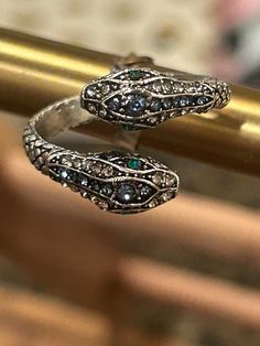 Adjustable snake ring with green crystals. Very trendy and definitely makes a statement. Beautiful piece. Comes packaged beautifully ready for gifting! Snake Rings, Snake Jewelry, Snake Ring, Green Crystals, Green Eyes, Statement Ring, Rings Statement, Statement Rings, Beauty Book