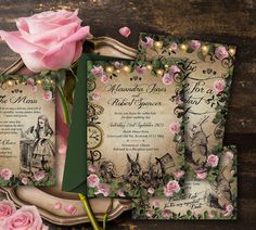 the wedding stationery is decorated with pink roses and fairy tale themed paper, along with matching envelopes