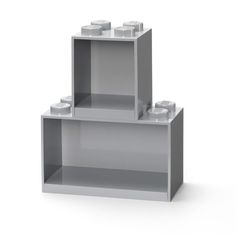 two legos are stacked on top of each other in the shape of a bookcase