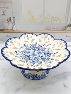 a blue and white bowl sitting on top of a counter