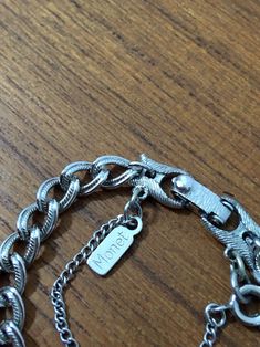 "Vintage signed Monet silver tone charm bracelet with Happy Birthday heart charm. Textured curb chain. Clasp and hang tag both marked Monet. Charm reads \"Happy Birthday\" in pretty script. Reverse has panel for optional custom engraving. Circa 1960s Charm is approx 1\" tall Bracelet chain is approx 1-1/4\" long. This is very high quality costume jewelry. In overall very good condition (some slight discoloration on the spring clasp that attaches charm to bracelet) Add more charms to this bracele Birthday Charm Bracelet, Happy Birthday Hearts, Birthday Heart, Vintage Silver Earrings, Vintage Charm Bracelet, Bracelet Heart, Vintage Monet, Bracelet Chain, Curb Chain