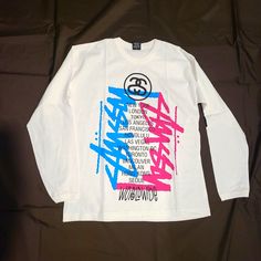 Stussy Worldwide Cities Tee. Deadstock Vintage. New Without Tags. White Long Sleeve Top With Graffiti Print, Trendy White Tops With Graffiti Print, Trendy White Top With Graffiti Print, Stussy Men, White Long Sleeve Tee, Striped Turtleneck, Pink Tee, Long Sleeve Tee Shirts, Signature Logo