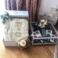 two boxes with personal items in them sitting on a table