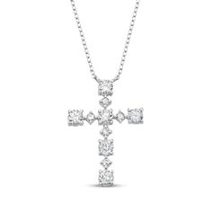 Make a meaningful impression with this dazzling cross necklace. 10K white gold Alternating sizes of round-cut diamonds shimmer in stations along the pendant Total diamond weight is 3/4 carat 18-inch cable chain with 2-inch extender; lobster clasp Silver Diamond Necklace, Accessories Jewelry Necklace, Silver Diamonds, Round Cut Diamond, Cable Chain, Lobster Clasp, Round Cut, Cross Necklace, Platinum