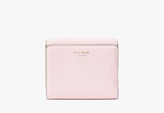 Say hello to our new icon. Made from smooth leather the Dakota features our signature K hardware for a bold modern look. Settle your tab in style with this compact bifold flap wallet. | Kate Spade Dakota Bifold Flap Wallet, Shimmer Pink Cheap Kate Spade Wallets With Card Slots, Affordable Elegant Kate Spade Wallets, Luxury Rectangular Kate Spade Wallet, Compact Kate Spade Wallet, Xmas 2024, Kate Spade Wallet, Christmas Birthday, Kate Spade New York, Say Hello