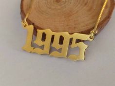 a gold plated necklace with the word hope on it