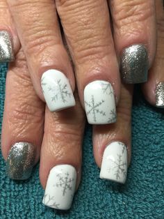 Silver Snowflake Nails, Winter White Nail Designs, Winter Nails 2023 Trends Snowflake, Winter White And Silver Nails, White Nails With Silver Snowflakes, Silver Winter Nails, Grey And White Snowflake Nails, Metallic Snowflake Nails, Grey Christmas Nails