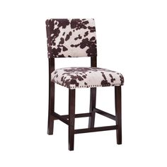 a black and white cow print bar stool with wooden frame, upholstered to the seat