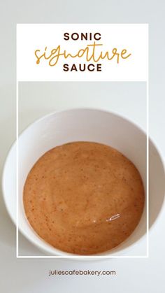 a white bowl filled with sauce on top of a table