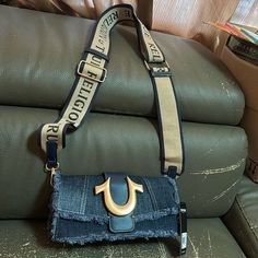 Selling True Religion Denim Bag Nwt. Includes Adjustable Removable Strap Drop 17”-27”. Gold Hardware. Denim Blue Bags With Branded Hardware, Denim Blue Crossbody Shoulder Bag With Adjustable Strap, Denim Crossbody Shoulder Bag With Mobile Phone Pocket, Daily Use Denim Shoulder Bag With Branded Hardware, Daily Denim Shoulder Bag With Branded Hardware, Denim Blue Crossbody Shoulder Bag With Removable Pouch, Everyday Denim Blue Bags With Branded Hardware, Denim Blue Bag With Detachable Strap, Denim Bags With Branded Hardware For Daily Use