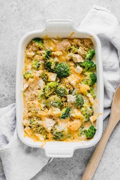 a casserole dish filled with broccoli and cheese