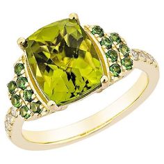 This collection features a selection of the most Olivia hue peridot gemstone. Uniquely designed this ring with tsavorite and diamonds in Yellow gold to present a rich and regal look. Peridot with Tsavorite and White Diamond Ring in 18 Karat Yellow Gold. Peridot: 3.67 carat, size: 10X8mm pear shape. Tsavorite: 0.28 carat, size: 1.60mm round shape. Diamonds: 0.11 carat, size: 1.50mm round shape G color, VS clarity. Gold: 4.748g, 18Karat yellow gold. R1684 Luxury Peridot Diamond Ring For Formal Occasions, White Diamond Ring, Peridot Gemstone, Naha, White Diamond, Pear Shaped, Round Shape, Fashion Rings, Diamond Ring