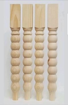 four wooden dowels lined up next to each other