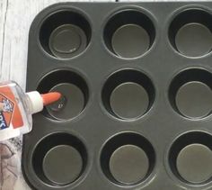 an orange cupcake tin being used to make muffins