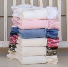 a stack of folded towels sitting on top of each other