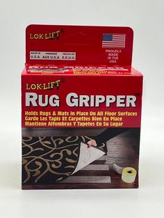 two boxes of rug grippers sitting on top of each other