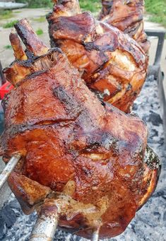 some meat is being cooked on the grill