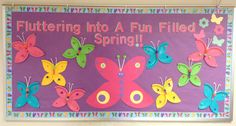 a bulletin board with butterflies on it that says, fluttering into a fun filled spring