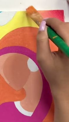 a person is using a brush to paint an image