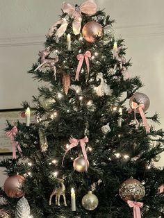 a decorated christmas tree with pink and silver ornaments