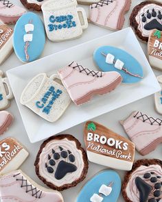 cookies decorated like sports shoes and boots are on display for the public to see if they're ready