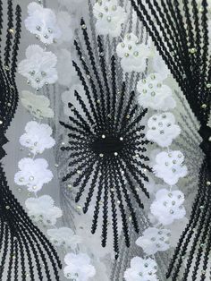 Absolutely Beautiful Embroidery lace with beads and sparkly rhinestone . Color White with black ornaments . Eco- Friendly. Breathable. Width 51”-52”sold by 1 yard. Elegant White Embellished Tulle Fabric, Elegant White Embellished Sequin Fabric, White Embellished Sequin Fabric For Parties, White Lace For Spring Party, White Embroidered Fabric For Party, White Fitted Sequin Fabric With Rhinestones, Fitted White Sequin Fabric With Rhinestones, Elegant White Beaded Embroidered Fabric, White Fitted Embroidered Fabric For Party