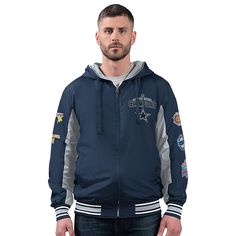 Officially Licensed NFL Cowboys Commemorative Reversible Hooded Jacket  Keep your team spirit alive during the colder months by rocking this Officially Licensed NFL Cowboys by Carl Banks Commemorative Reversible Hooded Jacket. One side has the Primary team color with secondary team color arm inserts. Embroidered commemorative championship applique left chest. Super Bowl championship appliques left sleeve. full back commemorative championship Embroidered applique with team logo. The other side has Secondary Team color with full team name and logo applique center chest. team helmet applique at left sleeve. team logo on back. Winter Team Spirit Fan Gear Outerwear, Team Spirit Outerwear For Sports Season, Winter Varsity Jacket For Fan Gear With Team Spirit, Winter Varsity Jacket For Team Spirit, Winter Varsity Jacket For Fan Gear, Team Spirit Hooded Outerwear For Sports Season, Throwback Hooded Varsity Jacket For Sports, Sporty Hooded Outerwear For Game Day, Collegiate Hooded Outerwear For Sports Events