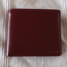 This Is A Gorgeous Red Wine/ Burgundy Colored Men's Leather Bi Fold Wallet With An Id Flap On The Left. It Is Crafted Of The Finest Leather And Made In Australia. It Comes With A Drawstring Dust Bag. New Never Used. It Would Make A Wonderful Gift! Classic Burgundy Wallet With Card Slots, Classic Burgundy Wallet With Interior Card Slots, Classic Burgundy Wallets With Interior Card Slots, Classic Burgundy Rectangular Wallets, Formal Burgundy Leather Wallets, Classic Red Business Wallet, Classic Burgundy Wallet For Business, Classic Tan Business Wallets, Classic Burgundy Bifold Wallet