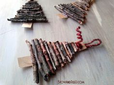 a group of sticks are arranged in the shape of a christmas tree on a table