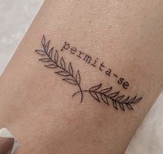 a woman's arm with a small tattoo on it that reads, pennite see