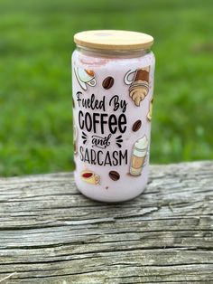 a glass jar with coffee and sarcasm on it sitting on a wooden table