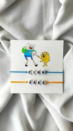 a bracelet with an image of finn and jake on it