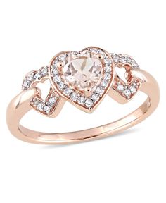 a heart shaped ring with diamonds on it