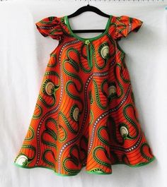 Custom Hand Made African print dresses made with high quality Ankara prints . This  Girl's African print Ankara dress Tutu Outfit is made in beautiful colors suitable for all occasions. Please start an Etsy conversation if interested in making this into family matching outfit or a mom and me matching outfit .  Perfect match for your children birthday party. Be it First  Birthday or 10th birthday milestone this beautiful tutu ball dress, we also make Birthday Tutu dress  Outfit and skirts . Thinking 1st birthday, 2nd birthday, 3rd Birthday, 4th Birthday, 5th Birthday, 6th Birthday, 7th Birthday, 8th Birthday, 9th Birthday, 10 birthday, 11th Birthday, 12th Birthday etc.. Just make sure to leave me custom request details or start an etsy conversation. Please send us a message if you need more Baby African Clothes, African Kids Clothes, African Dresses For Kids, African Fashion Skirts, African Inspired Clothing, Kids Dress Wear, African Children, African Fashion Traditional