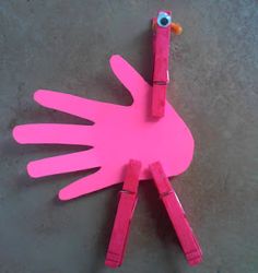 a pink bird made out of construction paper