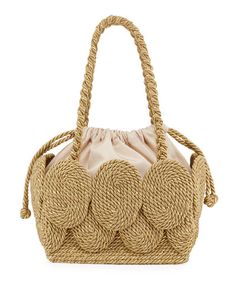 a straw bag with rope handles on the front and shoulder straps at the bottom, in beige