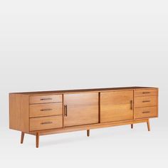 the sideboard is made out of wood and has four drawers, two doors and one drawer