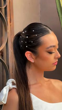 Prom Hairstyles Sleek Ponytail, Slick Back Pony With Pearls, Sleek Ponytail With Pearls, Pearls In Ponytail, Pearl Hair Slick Back, Low Ponytail With Rhinestones, Slick Back Ponytail With Pearls, Rhine Stone Hairstyles, Rine Stone Hairstyles