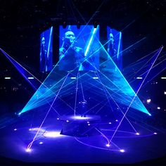 the stage is lit up with blue lights