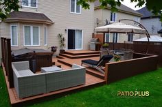 a backyard area with patio furniture and an umbrella