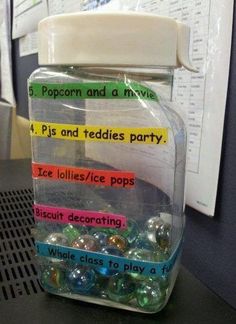 a jar filled with lots of different types of beads