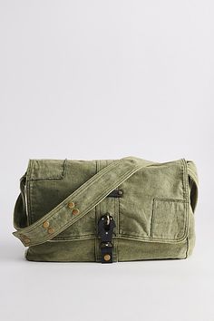 Classic look messenger bag with a flap top closure. Washed cotton bag with a secure latch closure front and rivet accents at the shoulder strap. Features Patched messenger bag Washed cotton bag Flap front Secure buckle down closure Shoulder strap Content + Care 100% Cotton Spot clean Imported | Patched Messenger Bag in Olive, Men's at Urban Outfitters Military Style Canvas Satchel Bag, Military Style Canvas Bag With Pockets, Canvas Satchel With Snap Closure For Daily Use, Daily Use Canvas Satchel With Snap Closure, Casual Flap Bag With Adjustable Strap, Green Canvas Satchel With Adjustable Strap, Military Style Canvas Shoulder Bag For Daily Use, Military Canvas Shoulder Bag For Everyday Use, Military Canvas Shoulder Bag For Daily Use