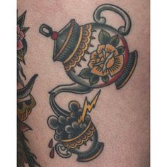 a tattoo design with teapots and flowers on the side of a woman's thigh