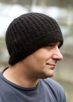 a man wearing a black knitted hat