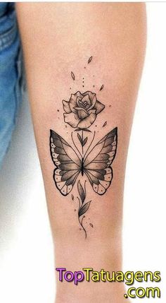 a woman's leg with a butterfly and rose tattoo on it