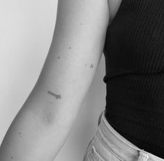 a woman with a tattoo on her arm