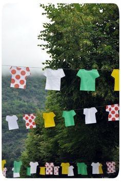 clothes hanging on a line with trees in the background