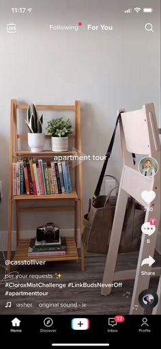 a room with bookshelves and plants in it