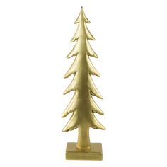 a gold christmas tree on a stand against a white background